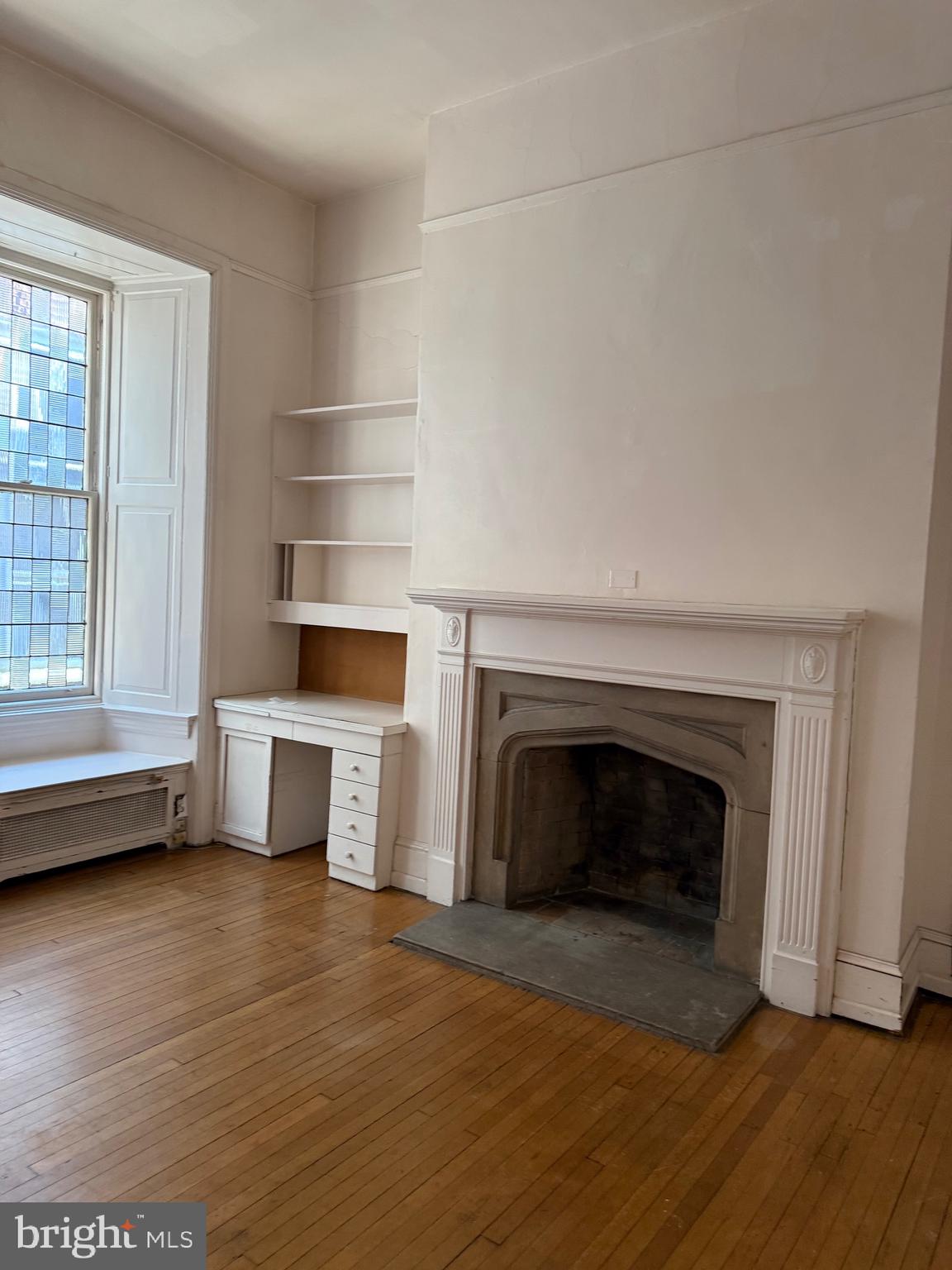 1720 Spruce Street, Unit 5 Philadelphia, PA 19103 - Photo 17 of 24 a view of livingroom with furniture and a fireplace