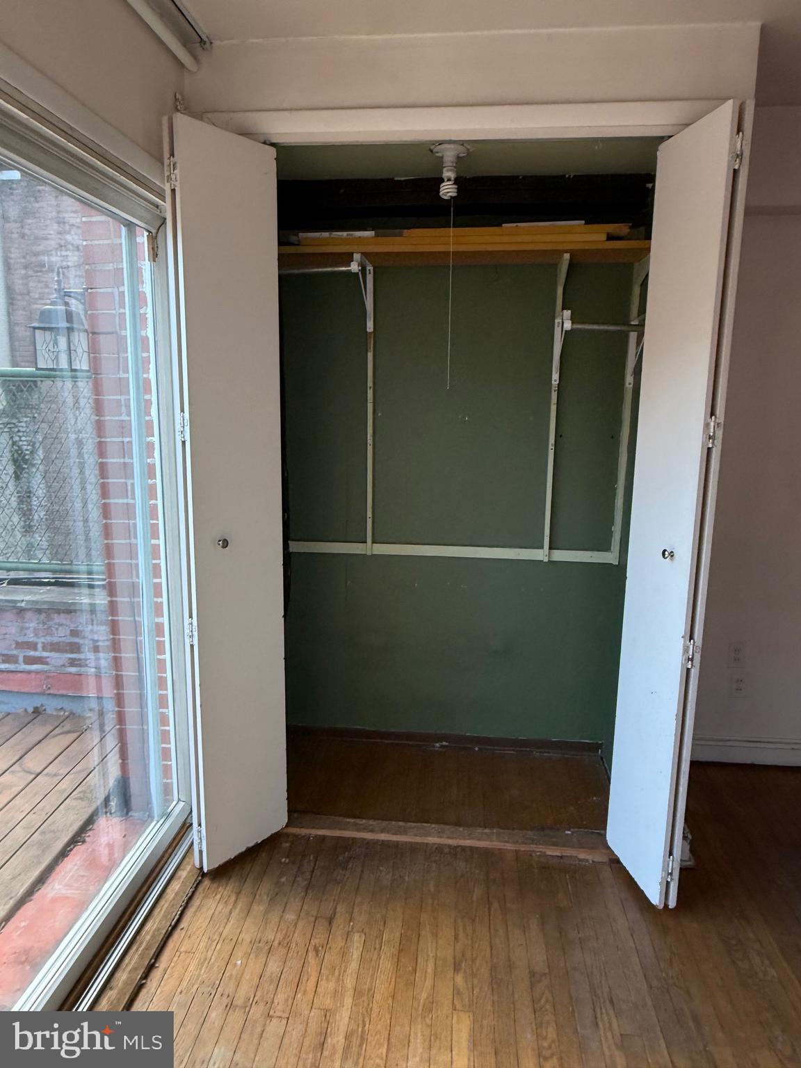 1720 Spruce Street, Unit 5 Philadelphia, PA 19103 - Photo 2 of 24 a view of empty room with wooden floor and windows