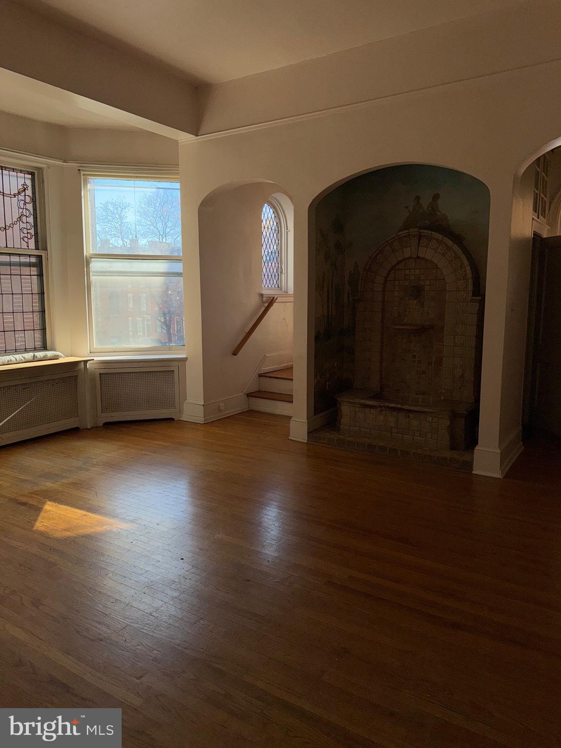 1720 Spruce Street, Unit 5 Philadelphia, PA 19103 - Photo 23 of 24 a view of empty room with wooden floor and fan
