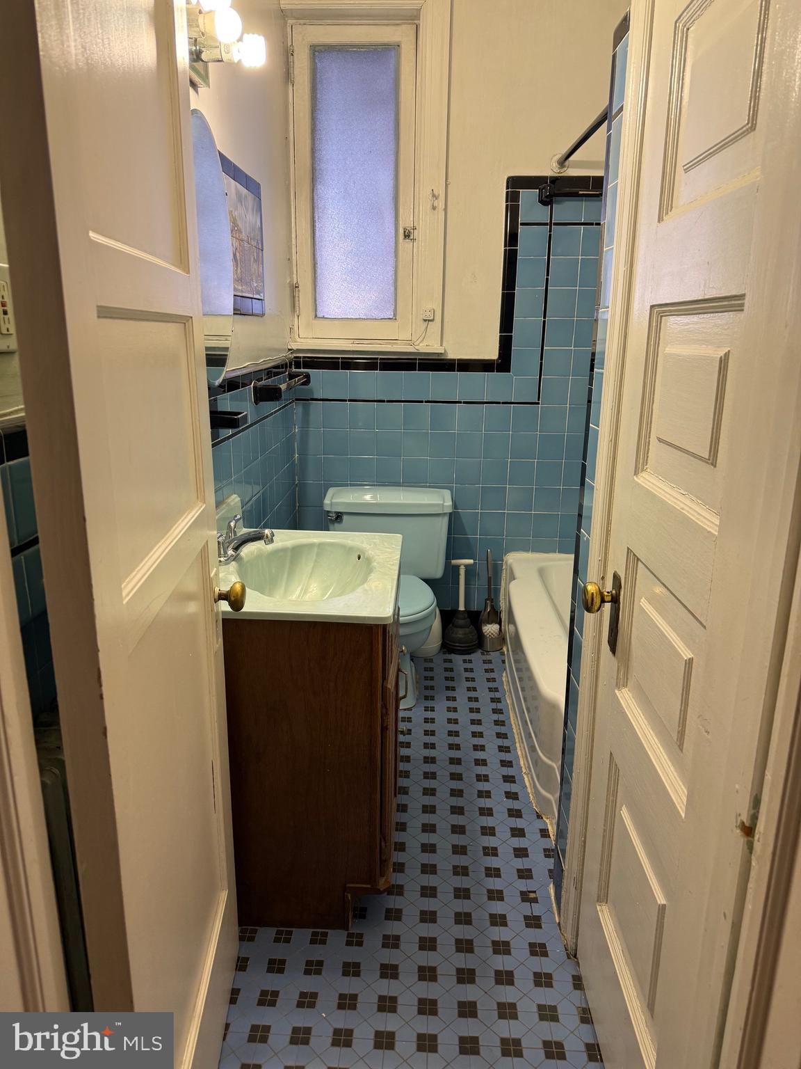 1720 Spruce Street, Unit 5 Philadelphia, PA 19103 - Photo 8 of 24 a bathroom with a sink and a mirror