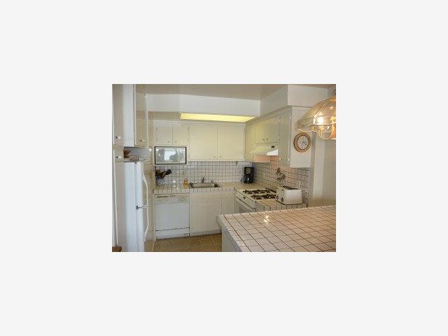 420 Oceanview Drive Watsonville, CA 95076 - Photo 4 of 9 a en suite bathroom with a sink a mirror and a bathtub