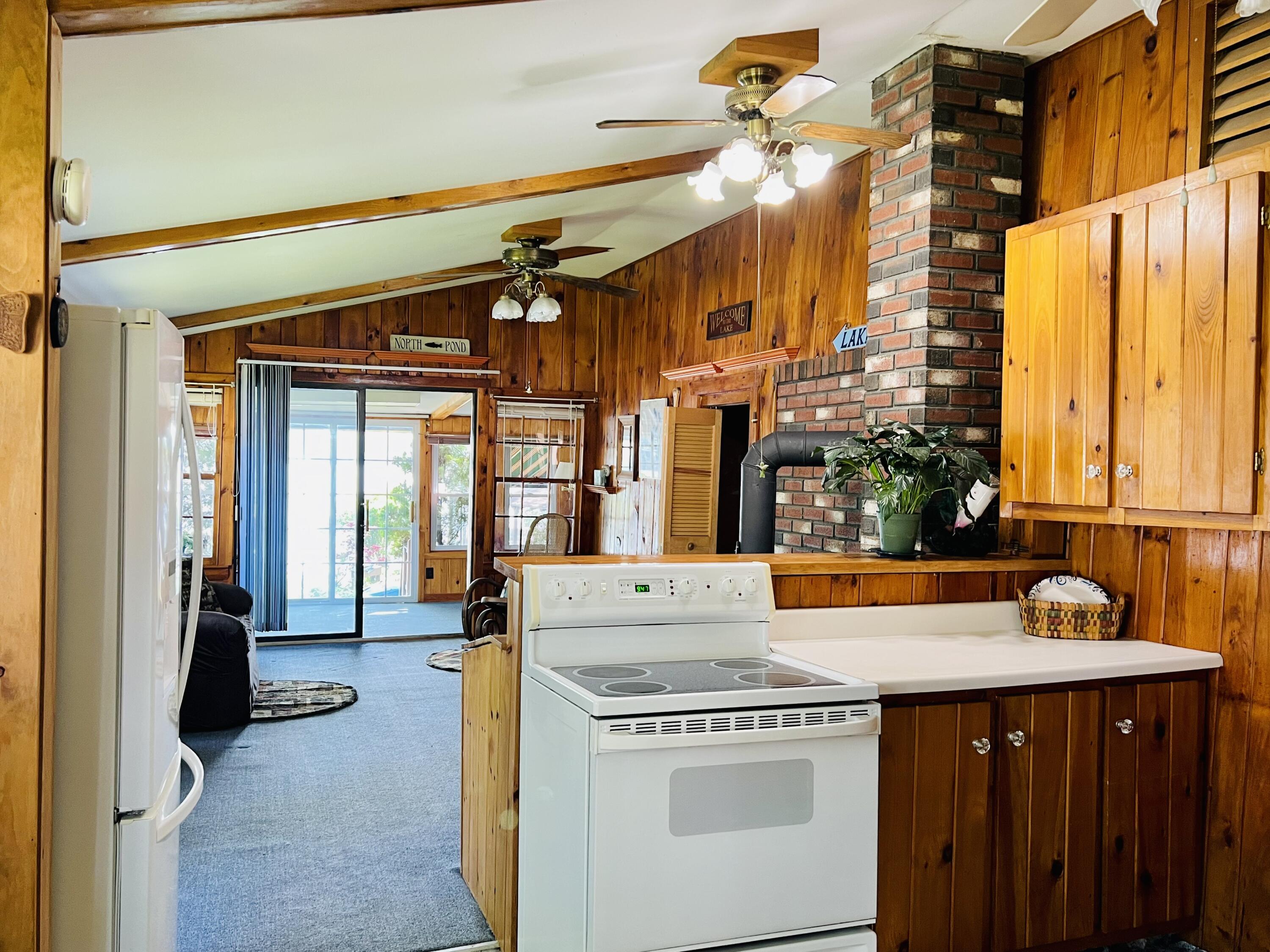 10 Brookside Lane Mercer, ME 04957 - Photo 16 of 36 Kitchen to sunroom