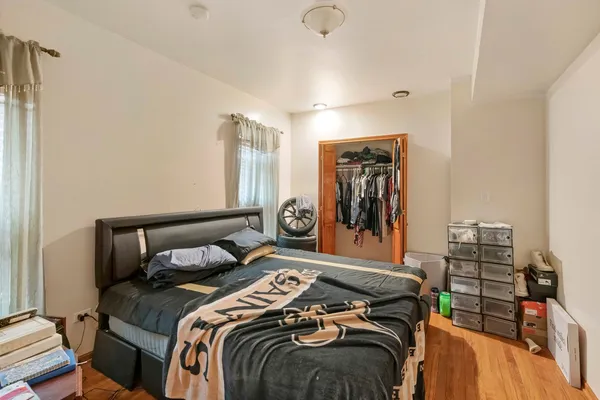 a bedroom with a bed and walk in closet