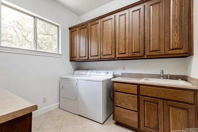a utility room with cabinets