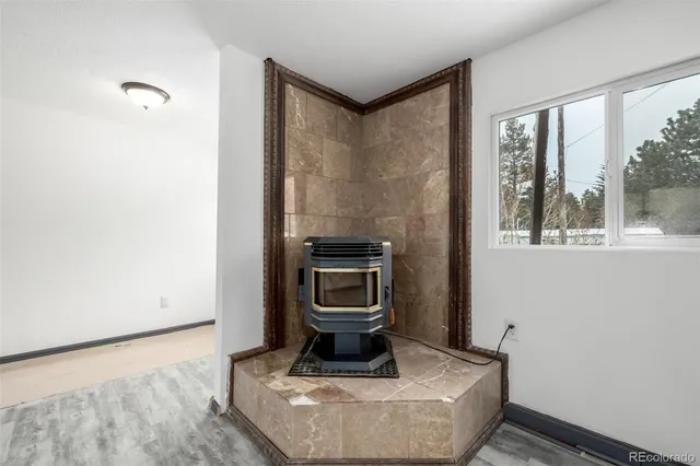 a living room with a couch and a window