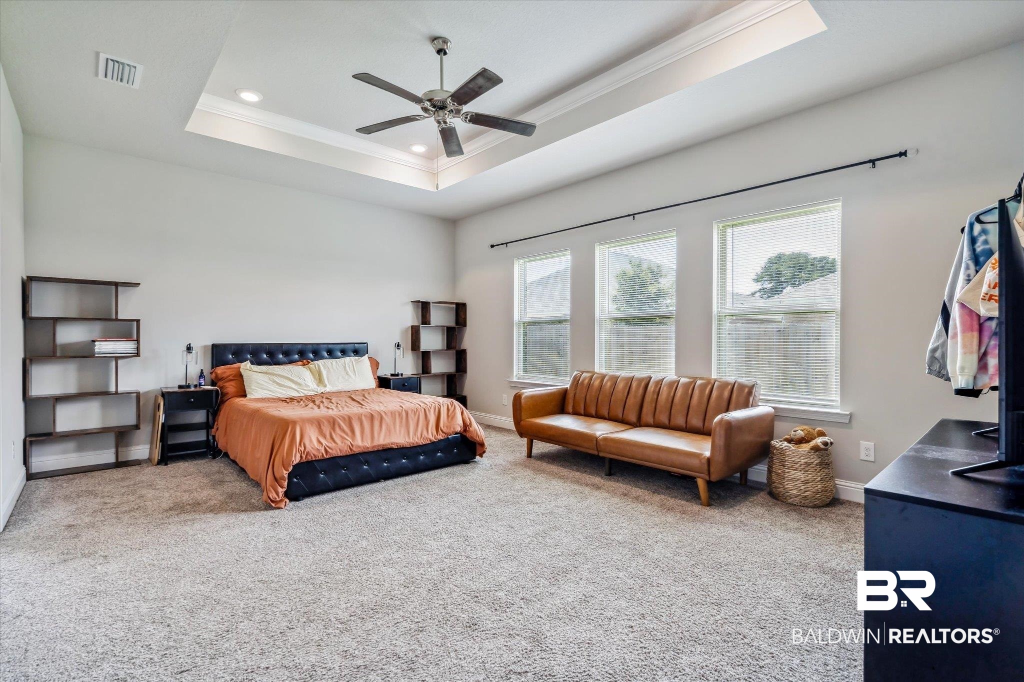 10501 Loamy Avenue Mobile, AL 36695 - Photo 14 of 30 Carpeted bedroom featuring ornamental molding, ceiling fan, and a tray ceiling