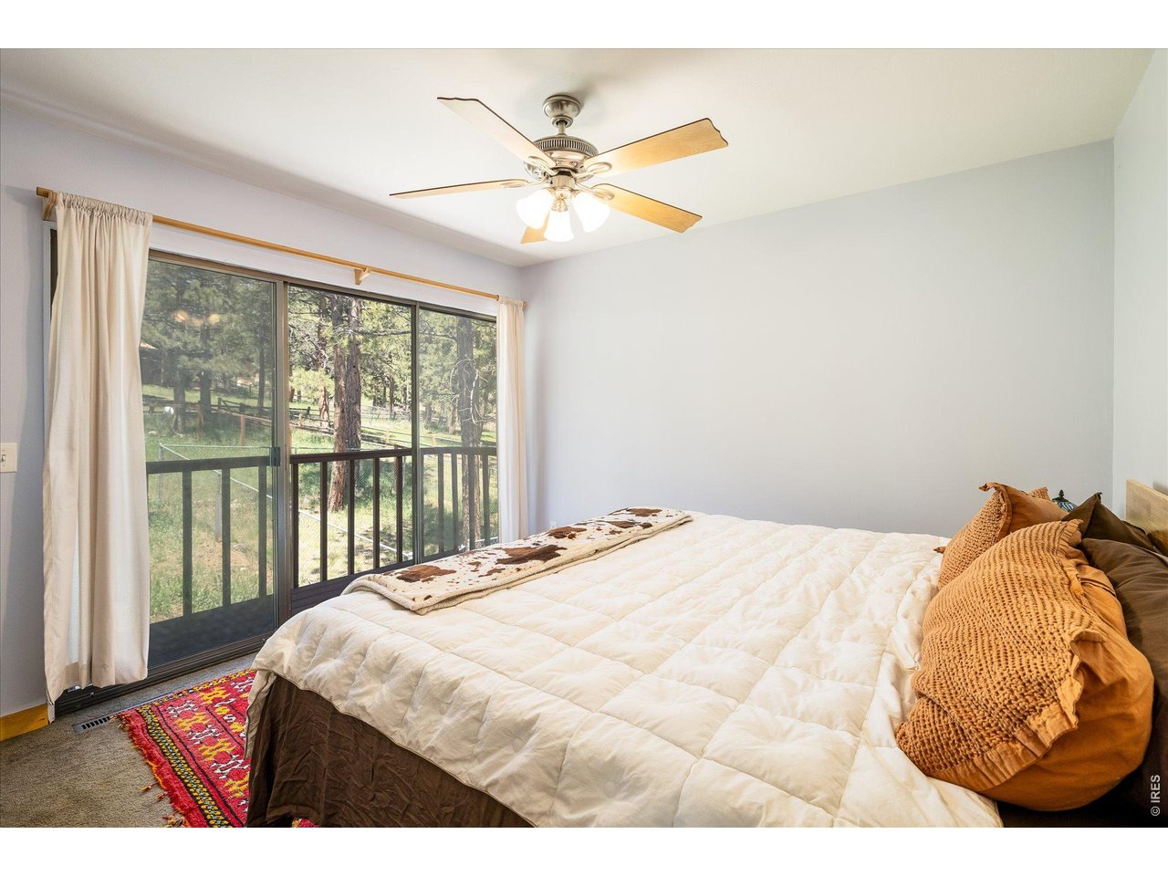 201 Wild Tiger Road Boulder, CO 80302 - Photo 17 of 43 upper level primary bedroom serves as a peaceful haven with its own private deck