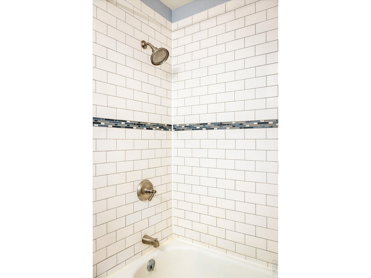 201 Wild Tiger Road Boulder, CO 80302 - Photo 22 of 43 enjoy clean and timeless white subway tile with mixed glass and stone mosaic tiles