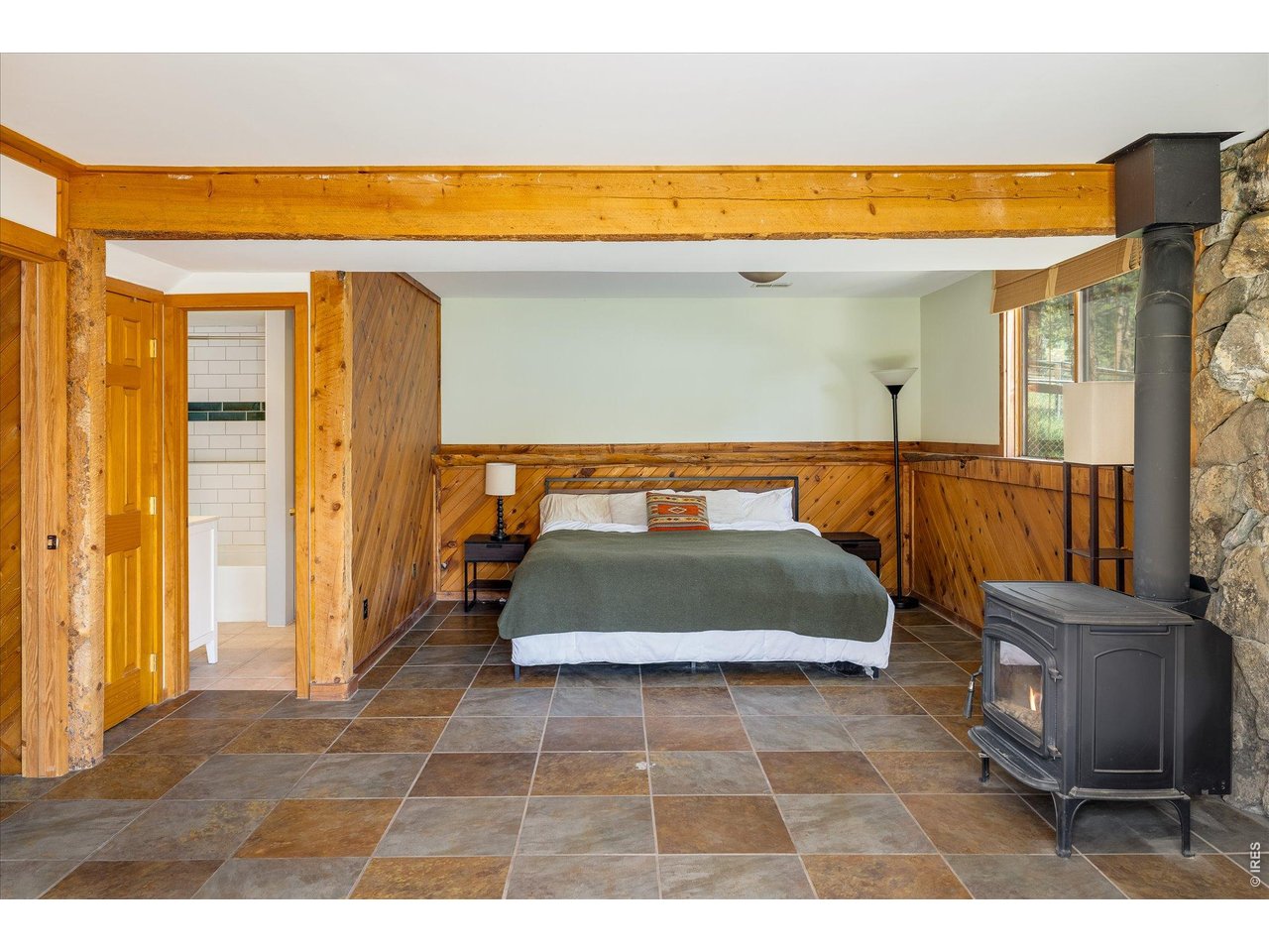 201 Wild Tiger Road Boulder, CO 80302 - Photo 23 of 43 enjoy the comfort of a Jotul wood stove in the lower-level family room, perfect for chilly mountain nights