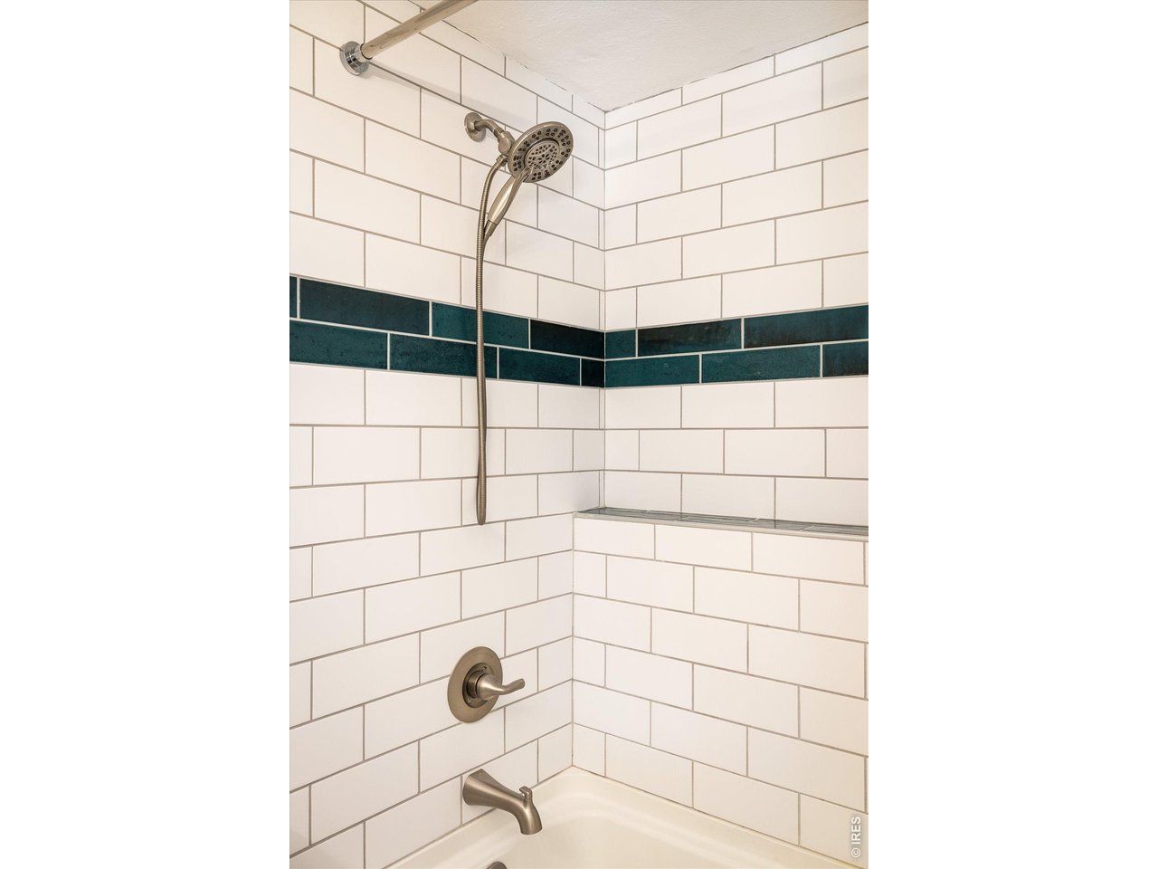 201 Wild Tiger Road Boulder, CO 80302 - Photo 25 of 43 classic white subway tile accented by deep emerald green tiles