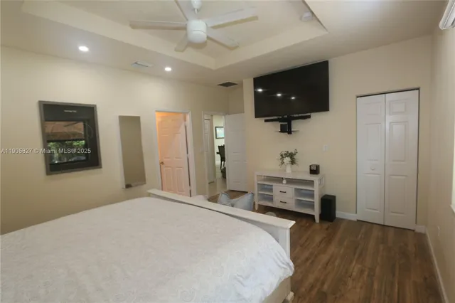 a bedroom with a bed and a dresser