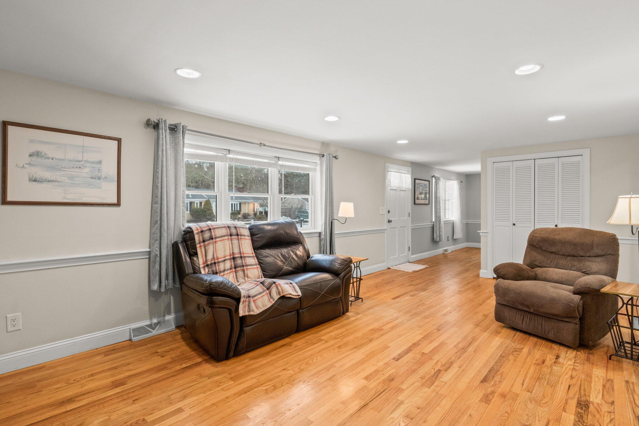 156 Sheaffer Road Centerville, MA 02632 - Photo 11 of 32 a living room with furniture and a large window