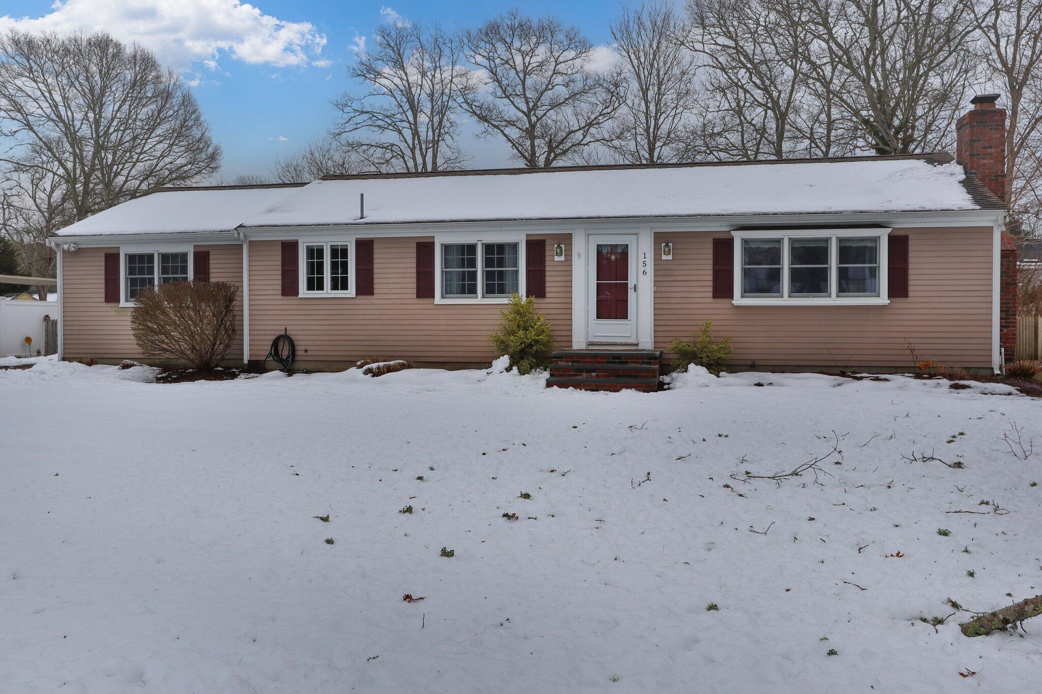 156 Sheaffer Road Centerville, MA 02632 - Photo 29 of 32 a front view of a house with a yard covered with snow