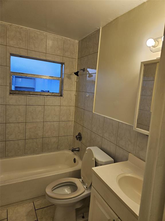 716 Southwest 7th Street, Unit 1 Dania Beach, FL 33004 - Photo 14 of 15 a bathroom with a sink a toilet and shower
