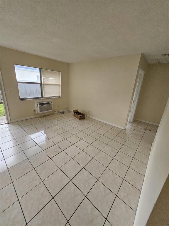 716 Southwest 7th Street, Unit 1 Dania Beach, FL 33004 - Photo 3 of 15 a view of a room with windows