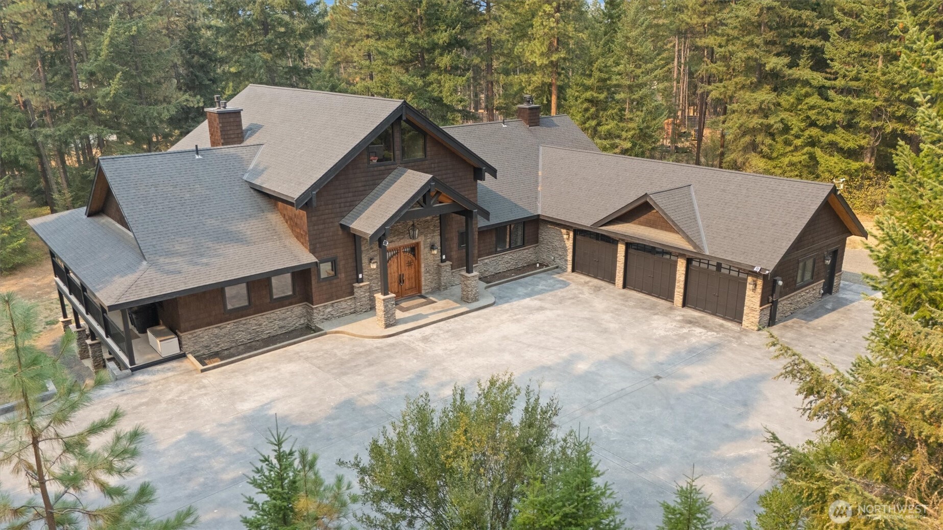 an aerial view of a house with a yard and balcony