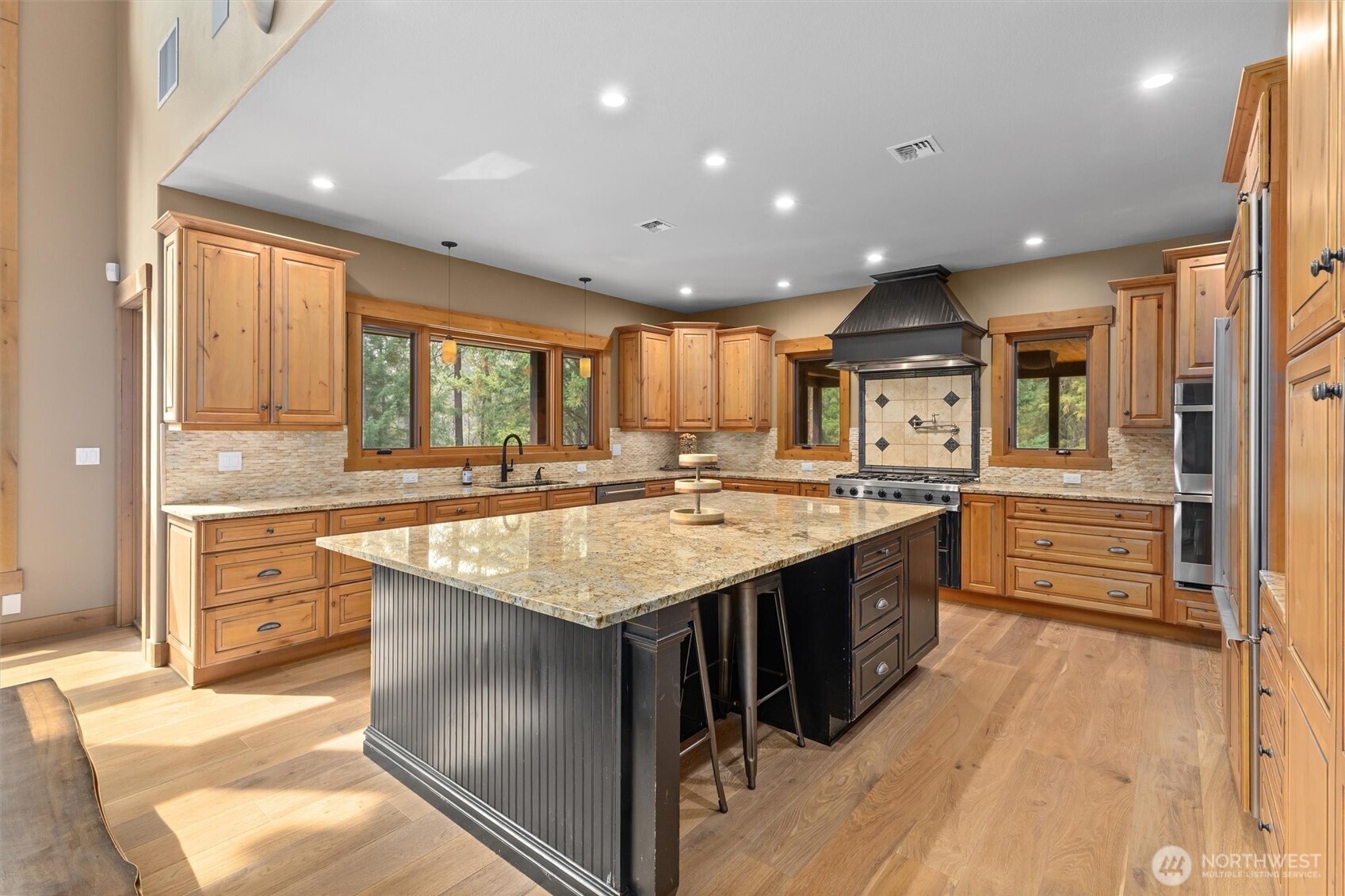 251 Evergreen Valley Loop Road Ronald, WA 98940 - Photo 12 of 40 a large kitchen with stainless steel appliances a large counter top a stove a sink and a refrigerator