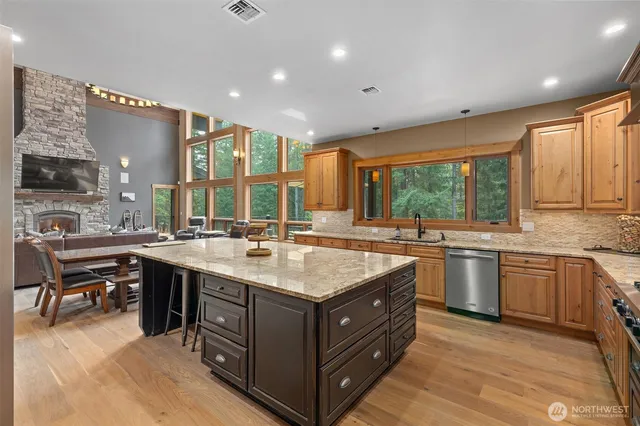 a kitchen with a stove sink and cabinets