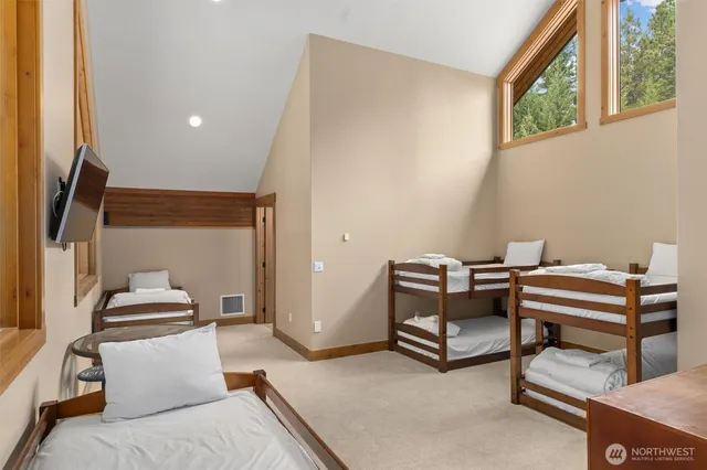 a bedroom with furniture and a window