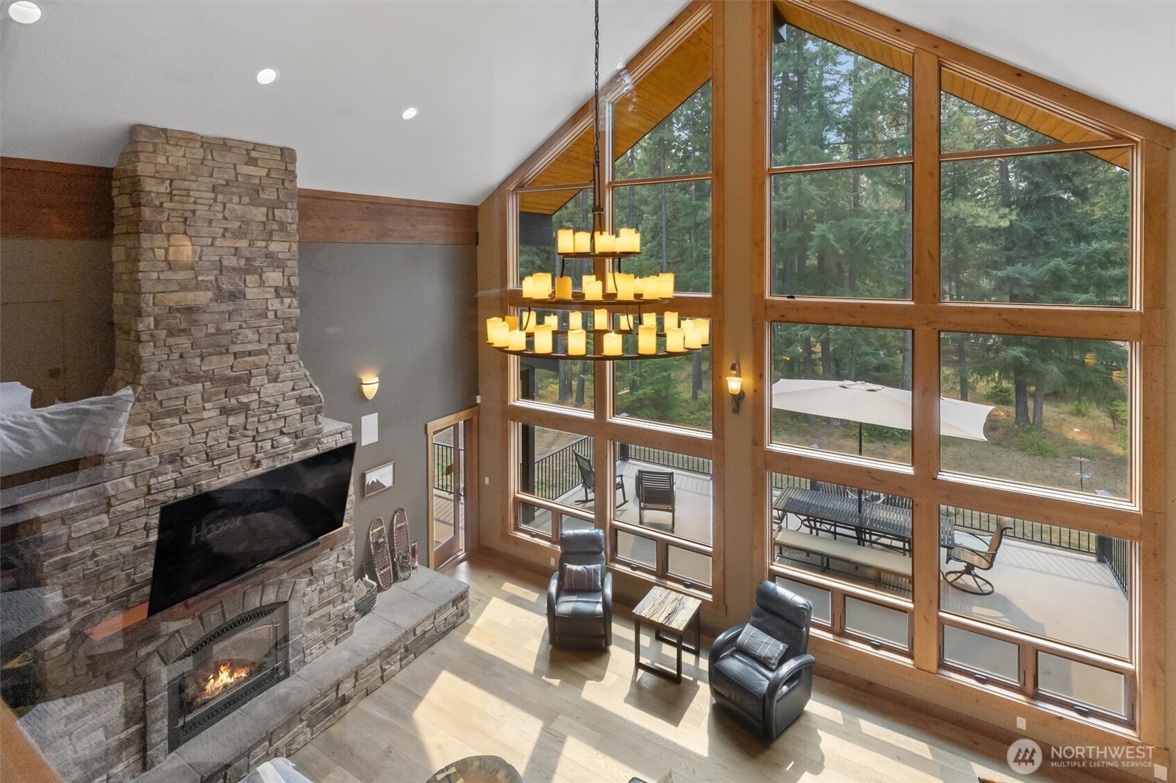 251 Evergreen Valley Loop Road Ronald, WA 98940 - Photo 8 of 40 a living room with fireplace furniture and a floor to ceiling window