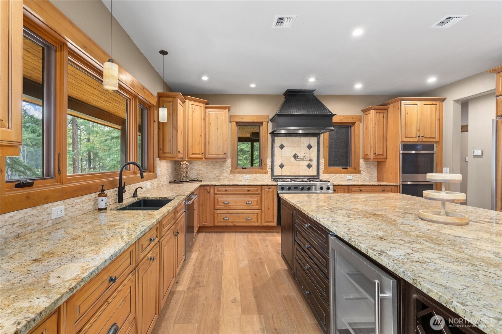 251 Evergreen Valley Loop Road Ronald, WA 98940 - Photo 10 of 40 a large kitchen with granite countertop a sink and a stove