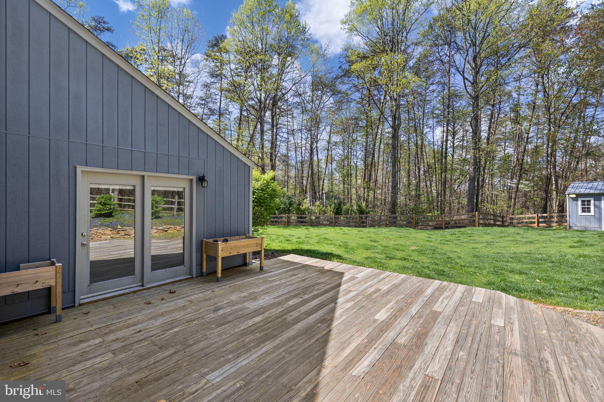 79 East Cedar Drive Ruckersville, VA 22968 - Photo 11 of 64 Deck deck off of primary bedroom