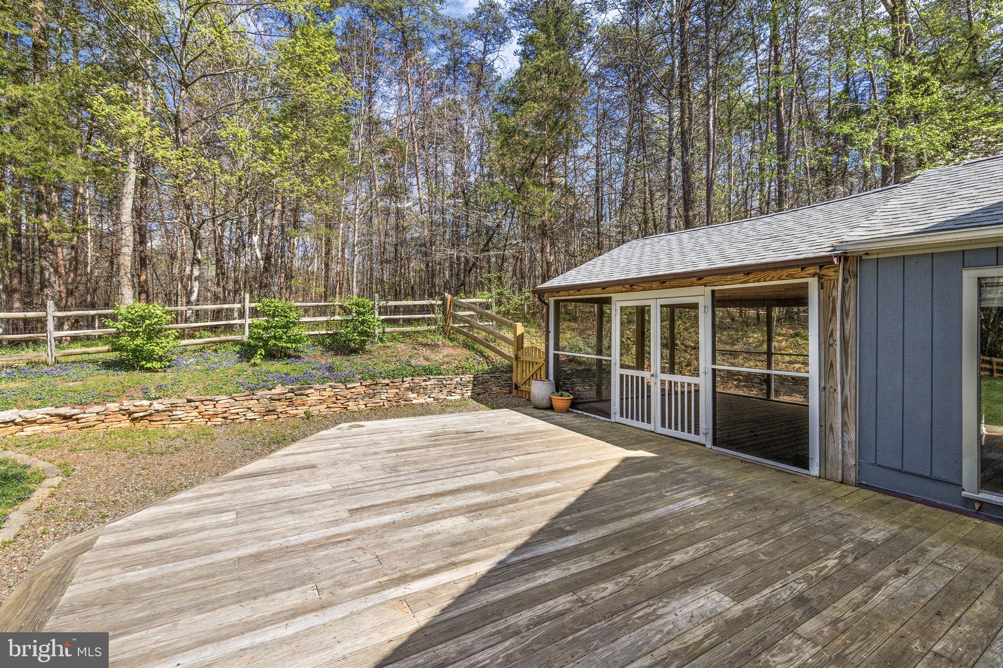 79 East Cedar Drive Ruckersville, VA 22968 - Photo 13 of 64 Deck off of screened porch