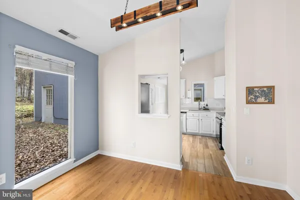 a view of a livingroom with a ceiling fan and window