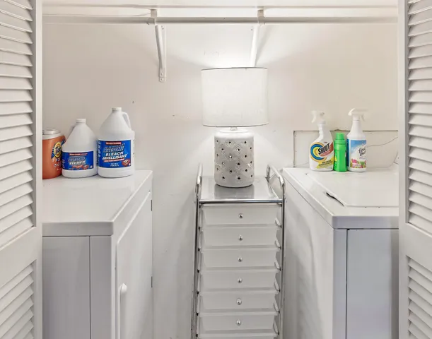 a kitchen with a sink a stove and cabinets