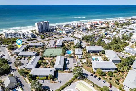 an aerial view of residential houses with outdoor space