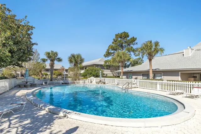 a view of a swimming pool with a patio