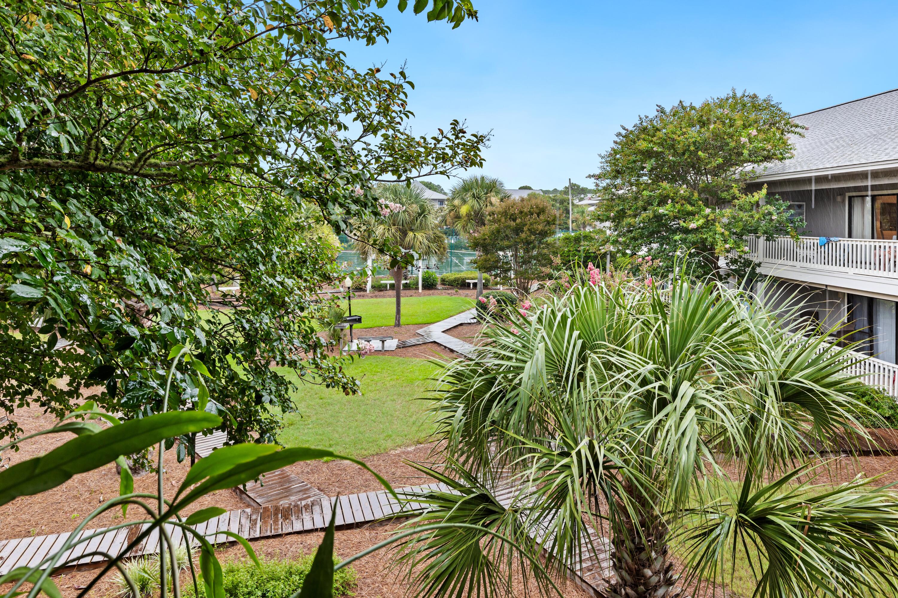 3799 East County Highway 30A, Unit D5 Santa Rosa Beach, FL 32459 - Photo 25 of 34 a view of a house with a yard