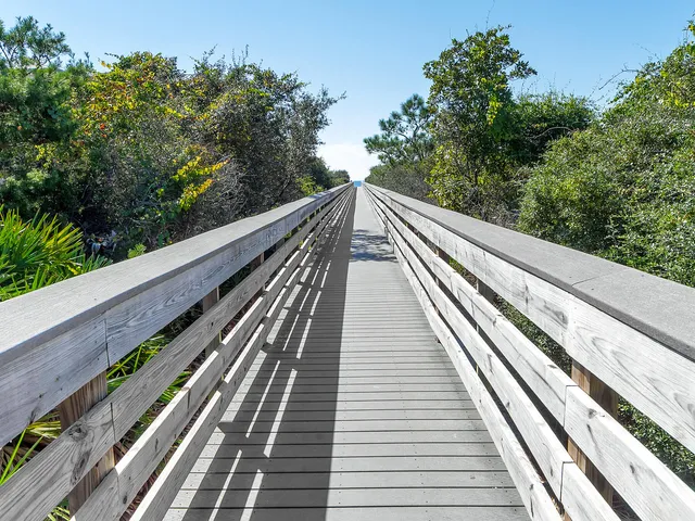 a view of a balcony with wooden floor