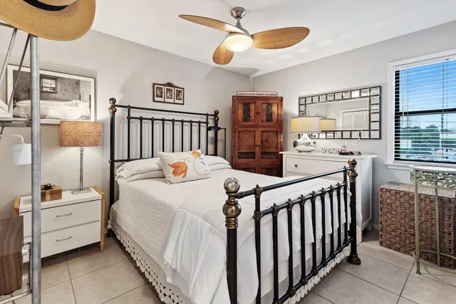 a bed room with a bed and a window