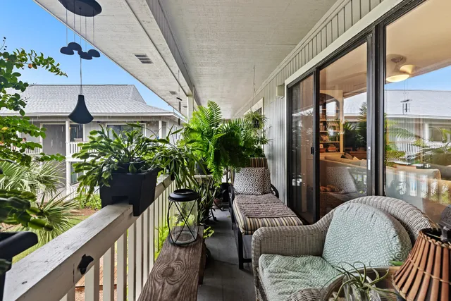 a view of balcony with furniture