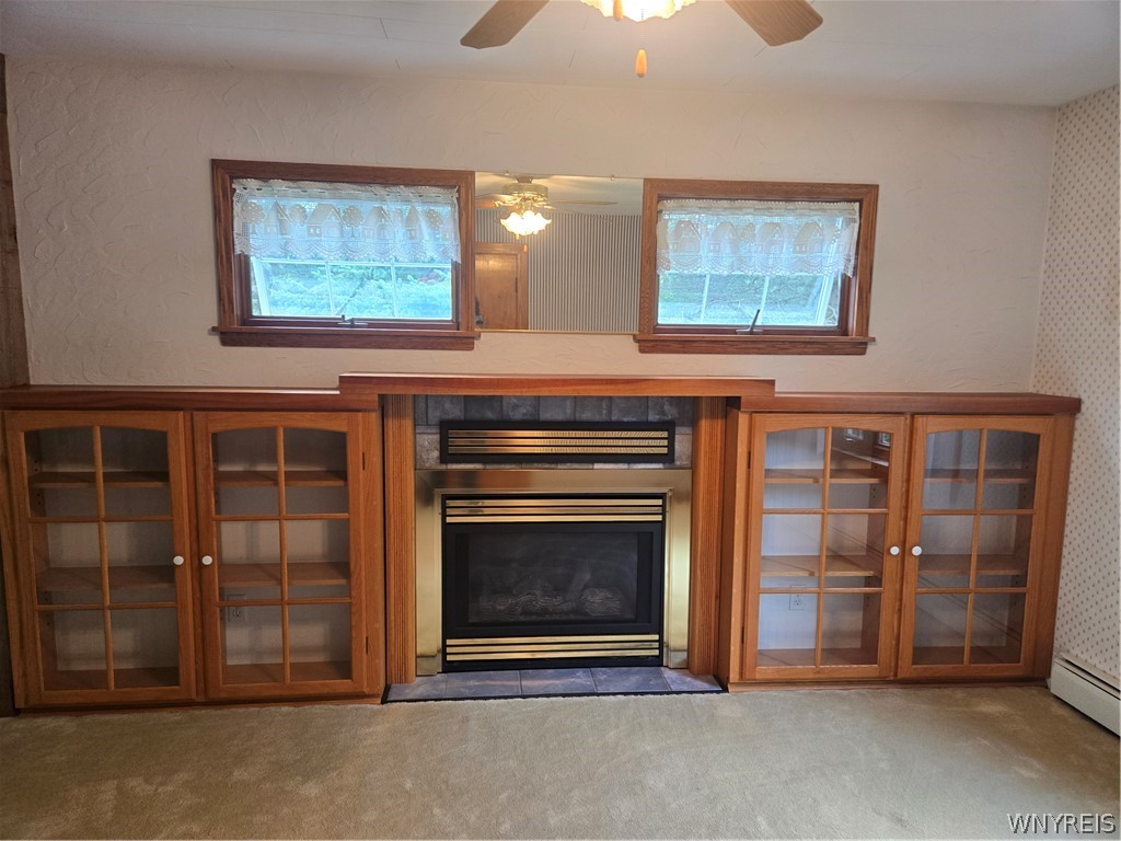 built in book cases with gas fireplace in living room