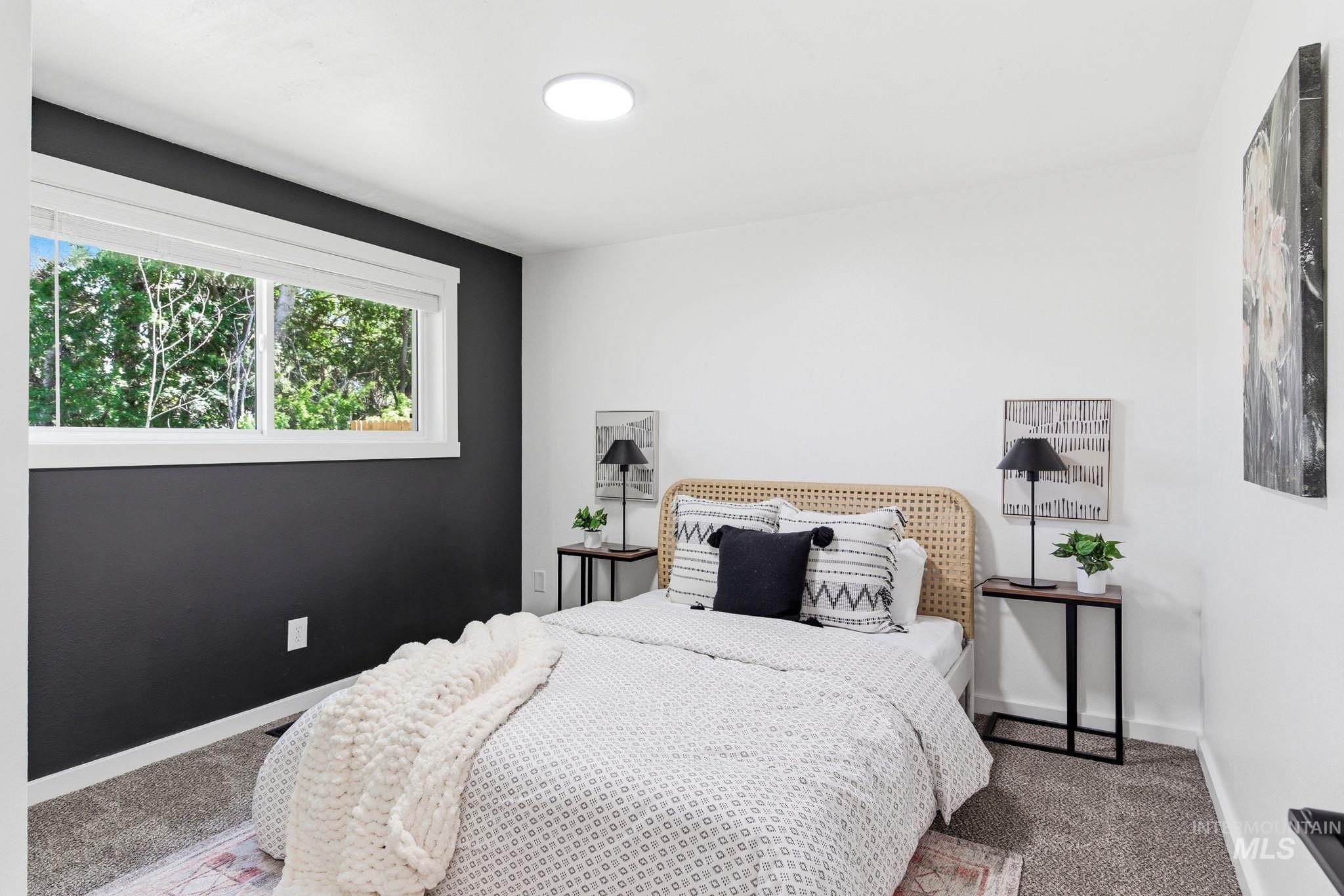 2224 Rachel Circle Boise, ID 83706 - Photo 25 of 50 Bedroom featuring a window with white trim, a dark accent wall, and recessed lighting