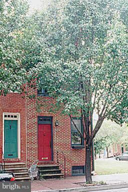 a view of a house with a tree