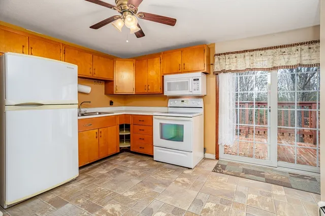 a kitchen with appliances cabinets and a sink