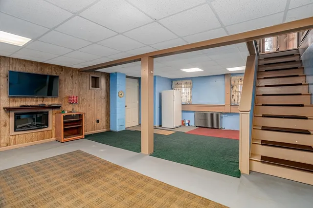 a view of a livingroom with a fireplace and furniture
