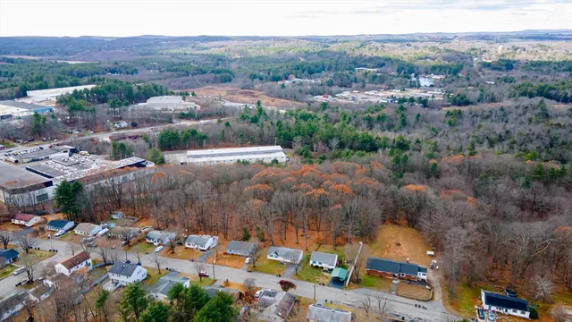 an aerial view of city and lake