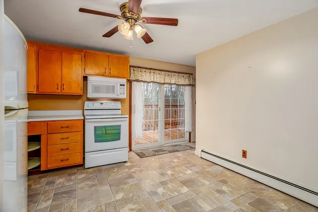a view of room with cabinet and windows
