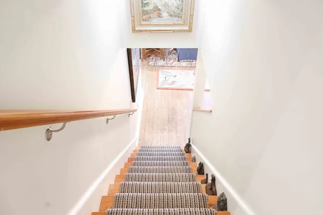 a bathroom with a granite countertop sink mirror bathtub and toilet