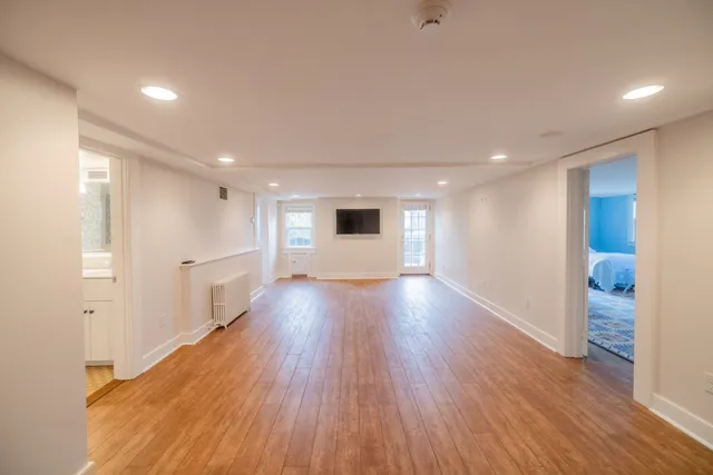 a view of a house with a yard and sitting area
