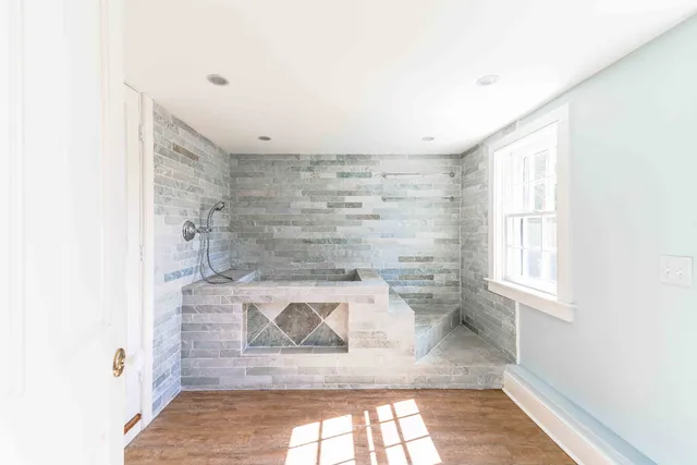 a front view of a house with yard and patio