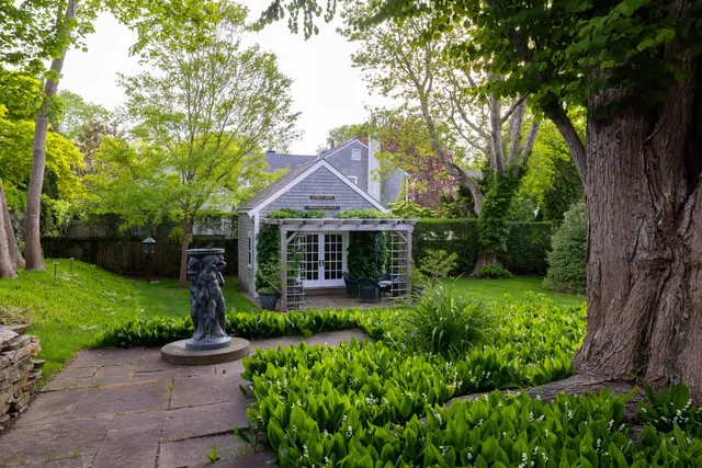 a backyard of a house with lots of green space