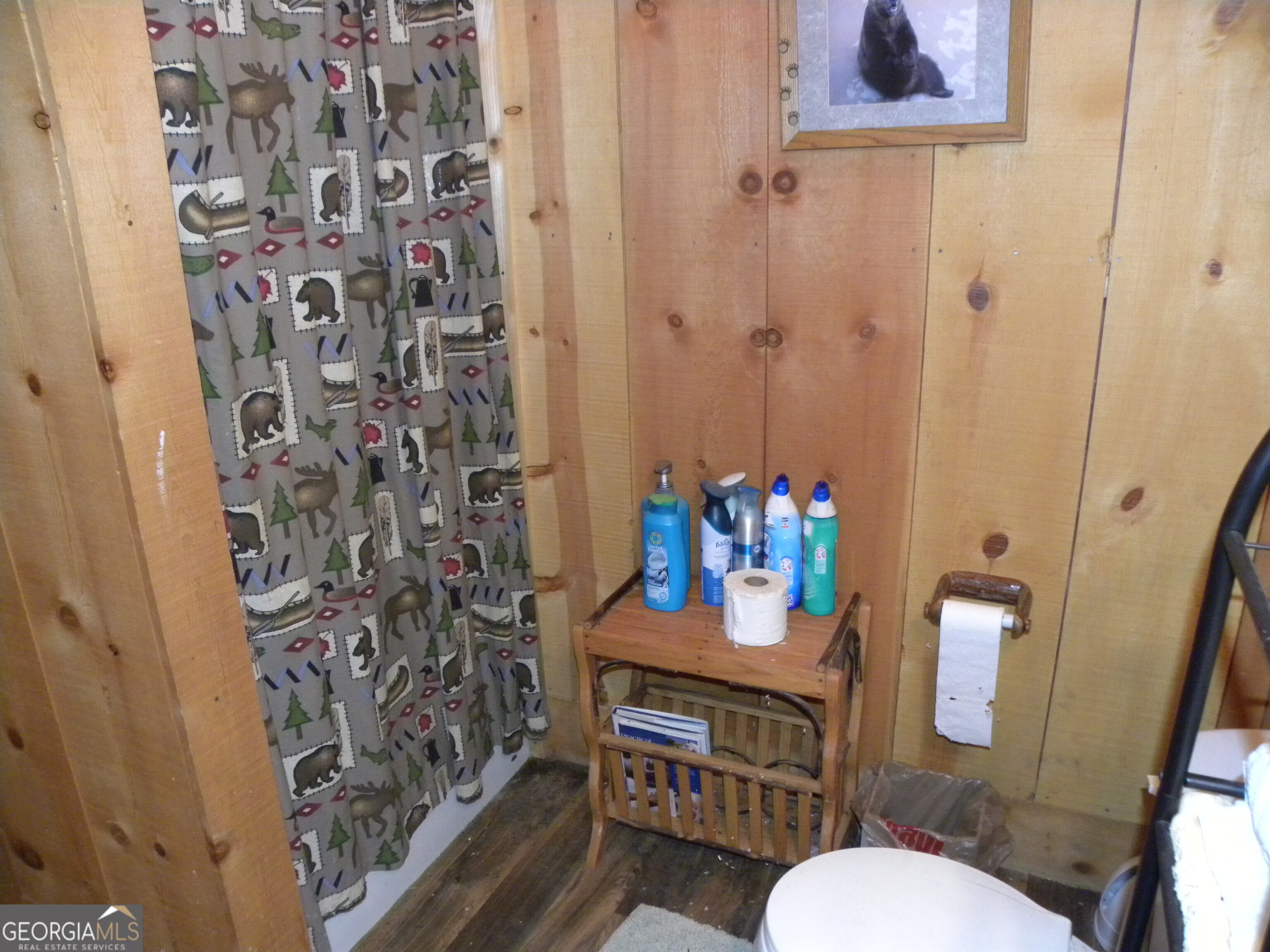 551 P Road Toccoa, GA 30577 - Photo 103 of 124 a bathroom with a toilet sink and a shower curtain