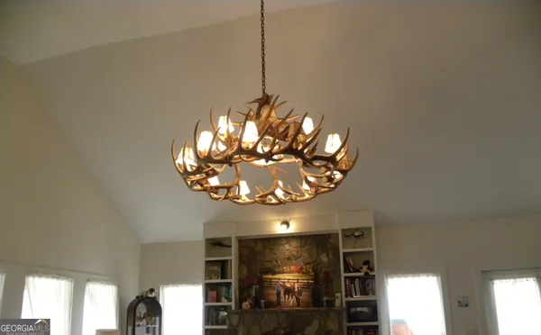 a kitchen with a sink a stove and cabinets