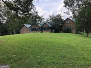 a house with a tree in front of it