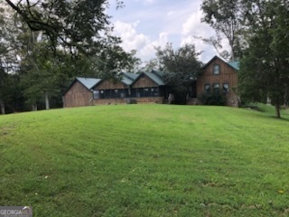 551 P Road Toccoa, GA 30577 - Photo 3 of 124 a house with a tree in front of it